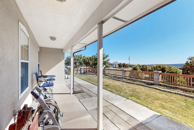 view of patio / terrace featuring fence