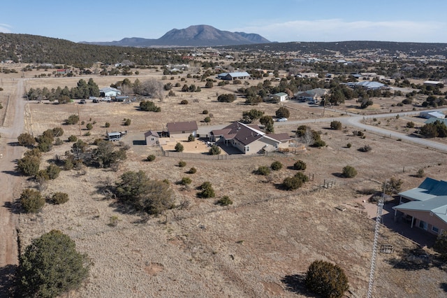 aerial view featuring view of desert and a mountain view