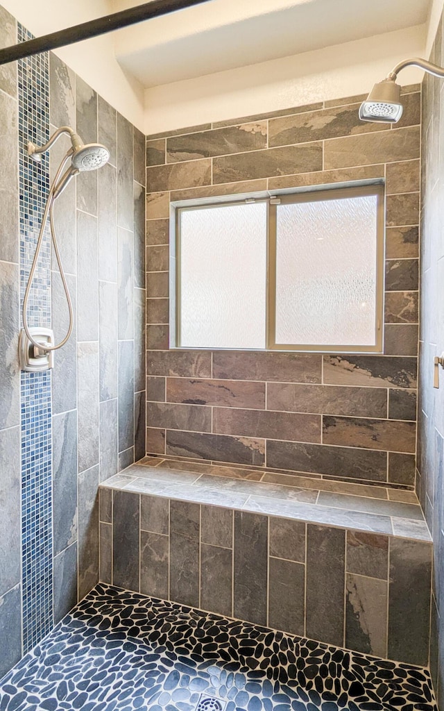 full bathroom featuring a tile shower