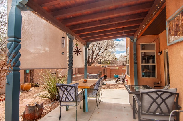 view of patio / terrace with outdoor dining space and fence