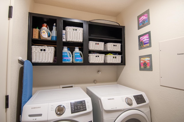 laundry area featuring washing machine and dryer and laundry area