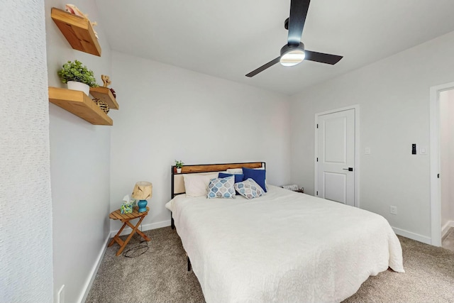 carpeted bedroom with baseboards and a ceiling fan