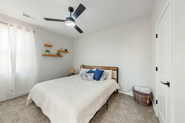 bedroom with visible vents, ceiling fan, and carpet flooring