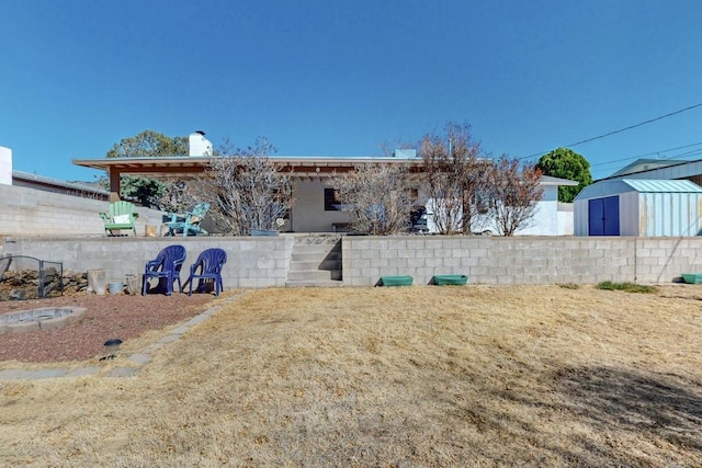 view of yard featuring an outbuilding and a storage shed