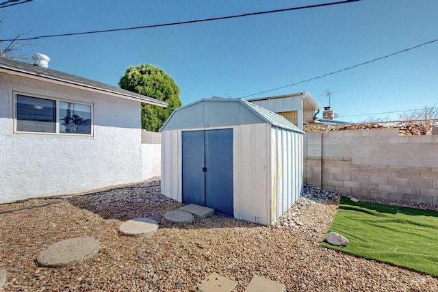 view of shed featuring a fenced backyard