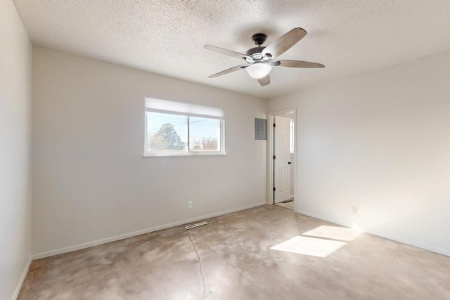 unfurnished room with baseboards, visible vents, a textured ceiling, and a ceiling fan