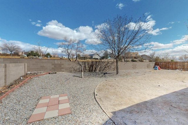 view of yard with a fenced backyard