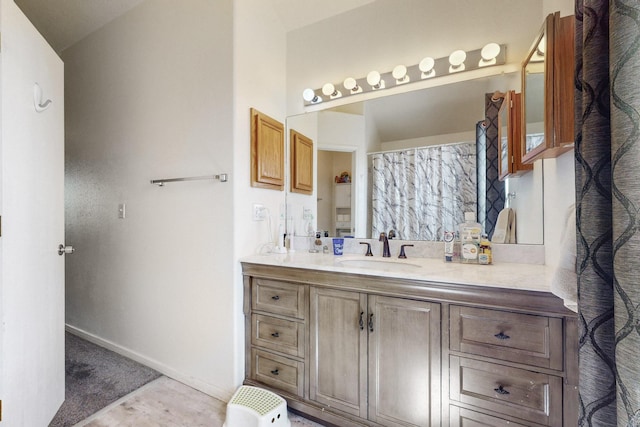 bathroom with vanity and baseboards