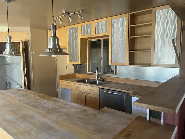 kitchen featuring wooden counters, a sink, glass insert cabinets, dishwasher, and decorative light fixtures