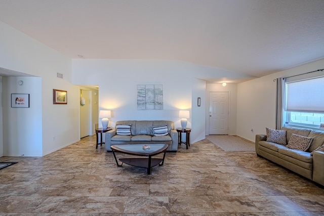 living room with visible vents, lofted ceiling, and baseboards