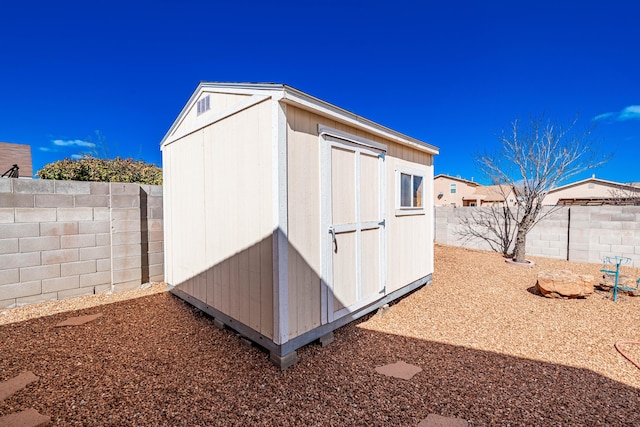 view of shed featuring a fenced backyard