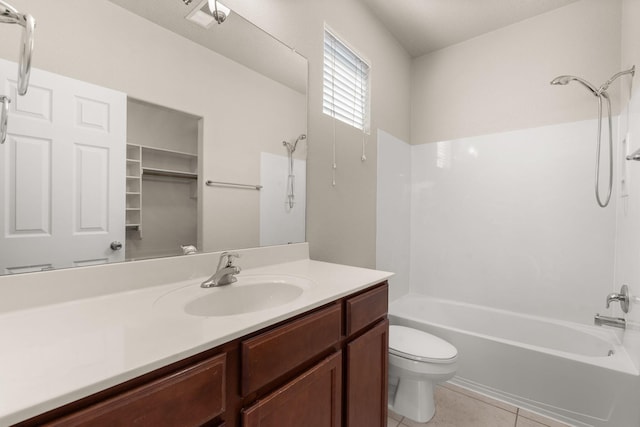 bathroom with shower / bathing tub combination, toilet, vanity, and tile patterned flooring