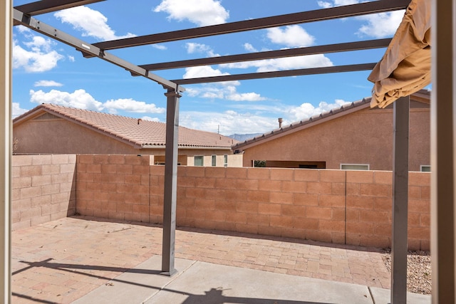 view of patio / terrace with a pergola and a fenced backyard