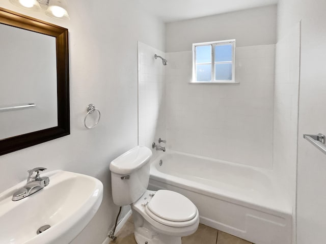 bathroom with a sink, toilet, shower / bathtub combination, and tile patterned flooring