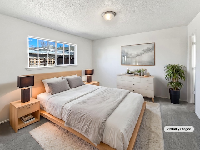 carpeted bedroom featuring a textured ceiling