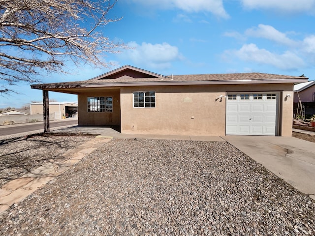 single story home featuring stucco siding, a garage, roof with shingles, and driveway