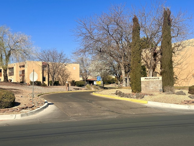 view of street with traffic signs and curbs