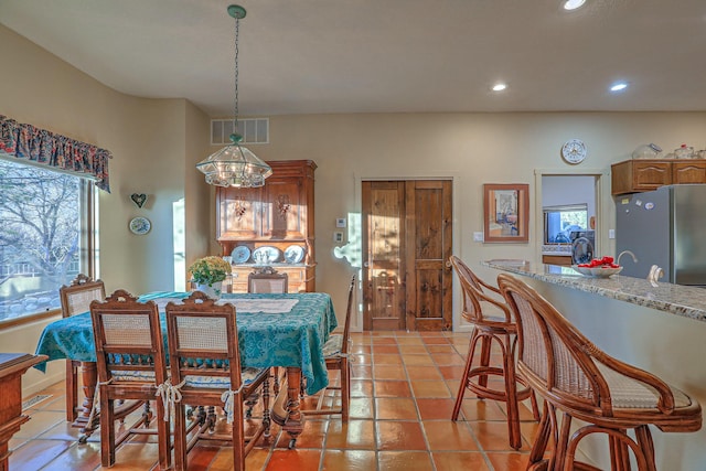 dining room with plenty of natural light, recessed lighting, visible vents, and light tile patterned floors