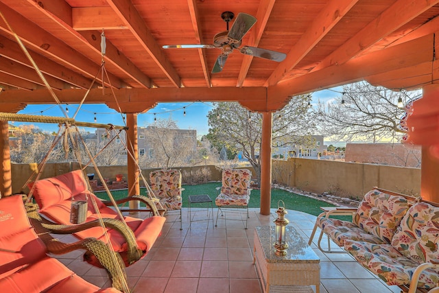 view of patio / terrace with a fenced backyard and a ceiling fan