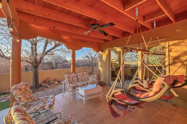 view of patio / terrace with ceiling fan and fence