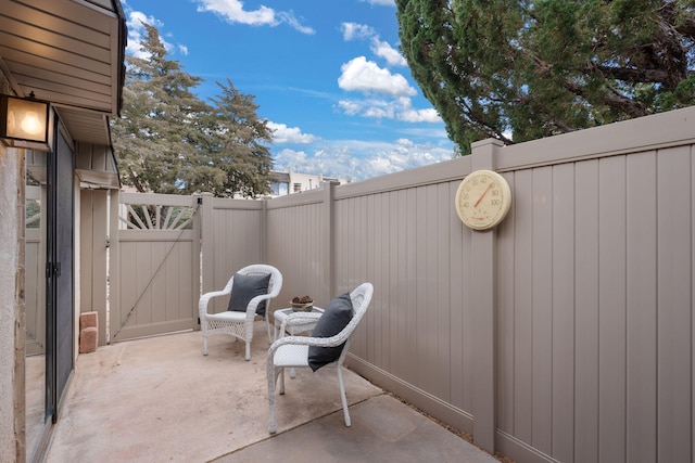 view of patio / terrace with fence and a gate