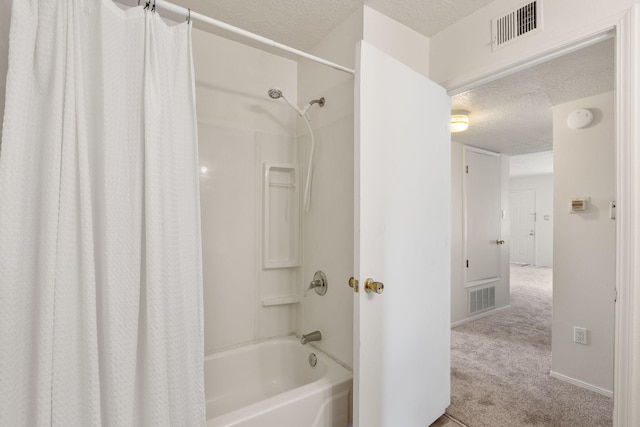 full bath with visible vents, shower / bathtub combination with curtain, a textured ceiling, and baseboards