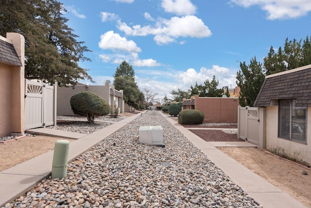 view of yard with fence and a gate