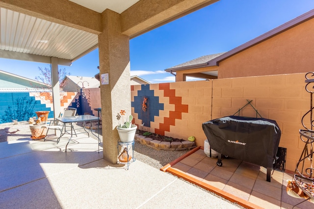 view of patio / terrace featuring area for grilling, outdoor dining area, and fence