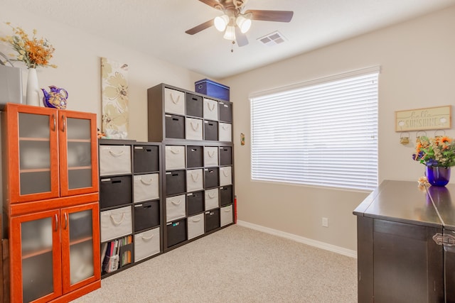 storage room featuring visible vents and a ceiling fan