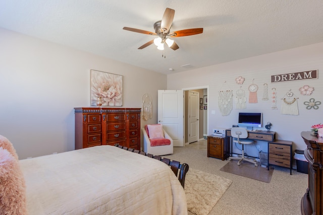 bedroom with a textured ceiling and a ceiling fan