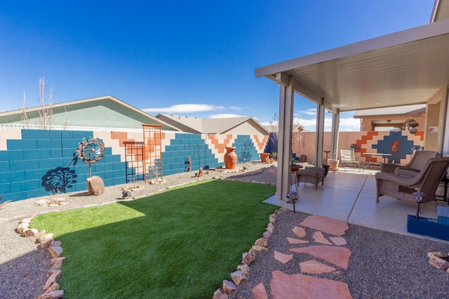 view of yard featuring a fenced backyard and a patio