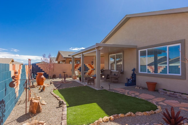 view of yard featuring a patio and a fenced backyard