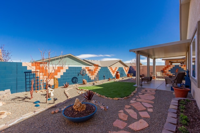 view of yard with a fenced backyard, a playground, and a patio