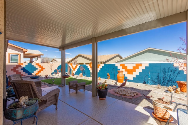 view of patio / terrace featuring a fenced backyard and a fire pit