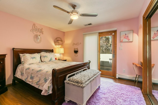 bedroom featuring visible vents, access to exterior, wood finished floors, baseboards, and ceiling fan