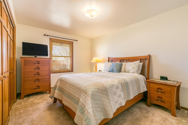 bedroom with light colored carpet