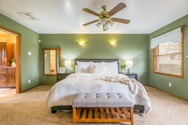 bedroom featuring visible vents, carpet floors, and baseboards