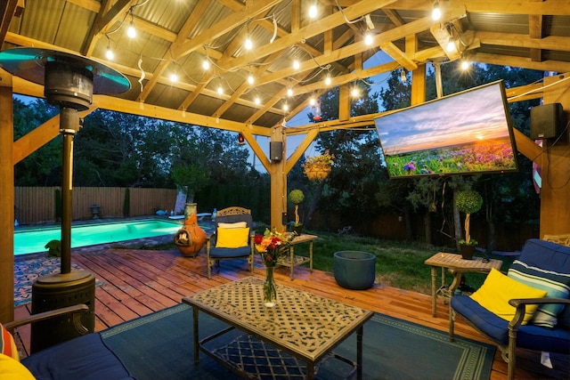 view of patio with a fenced backyard, a fenced in pool, and a wooden deck