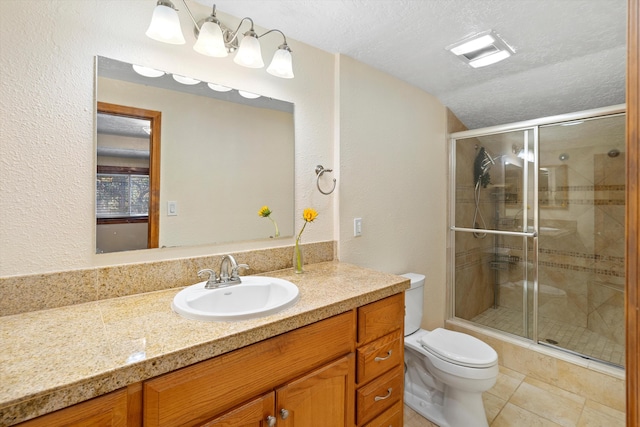 full bathroom featuring a textured ceiling, a stall shower, tile patterned flooring, and toilet