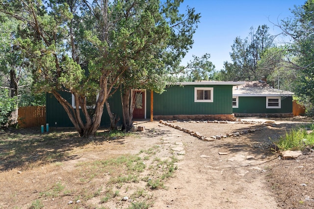 view of front of home featuring fence