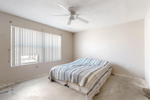 bedroom with unfinished concrete flooring, a textured ceiling, and a ceiling fan