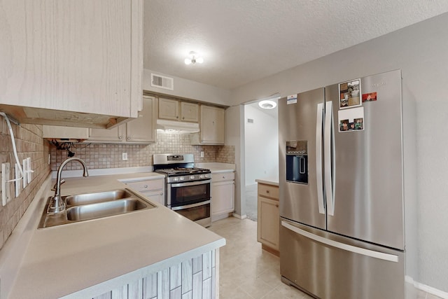 kitchen featuring light countertops, visible vents, appliances with stainless steel finishes, and a sink