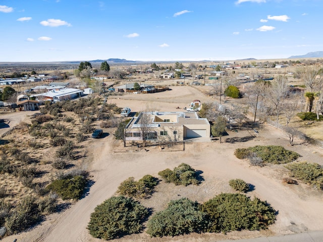 aerial view featuring a mountain view and a desert view