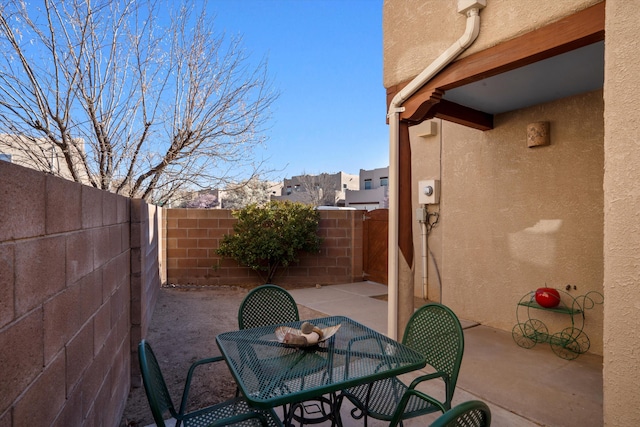 view of patio featuring a fenced backyard and outdoor dining space