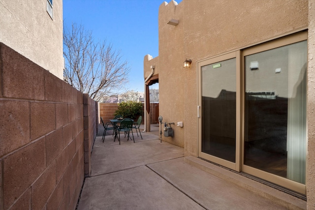 view of patio featuring outdoor dining area and a fenced backyard