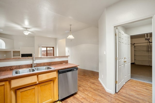 kitchen with ceiling fan, dishwasher, light wood-style floors, hanging light fixtures, and a sink