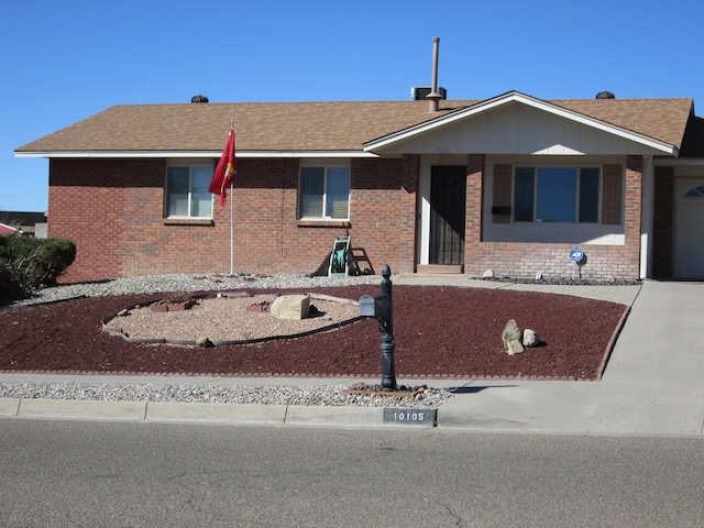 single story home with brick siding