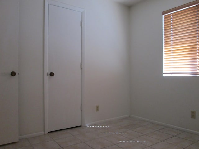 empty room with baseboards