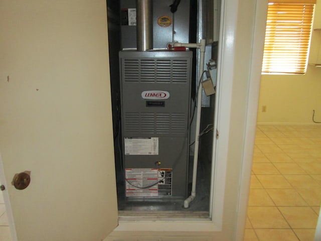 utility room featuring heating unit