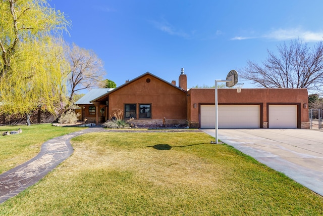 view of front of home with driveway, a chimney, a front lawn, stone siding, and a garage